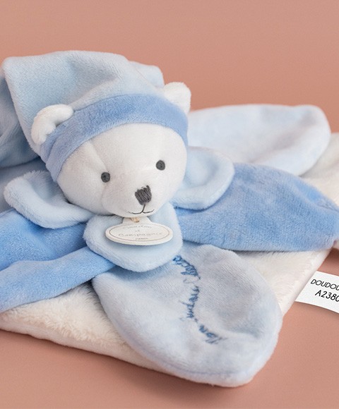 doudou ours avec petales bleus