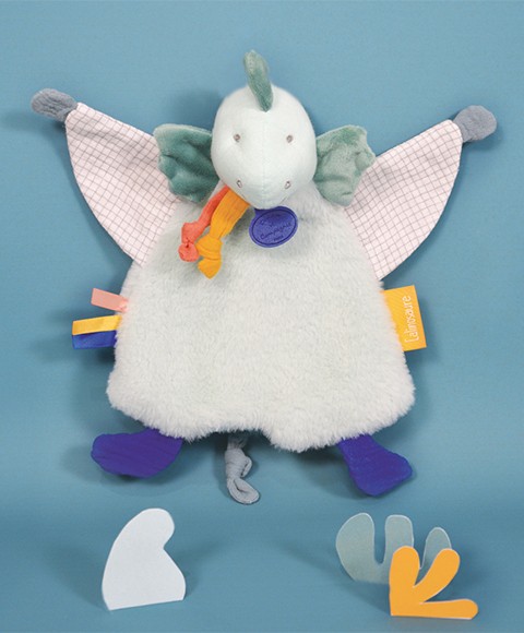 doudou dinosaure vert amande avec motifs petits carreaux et touches colorées