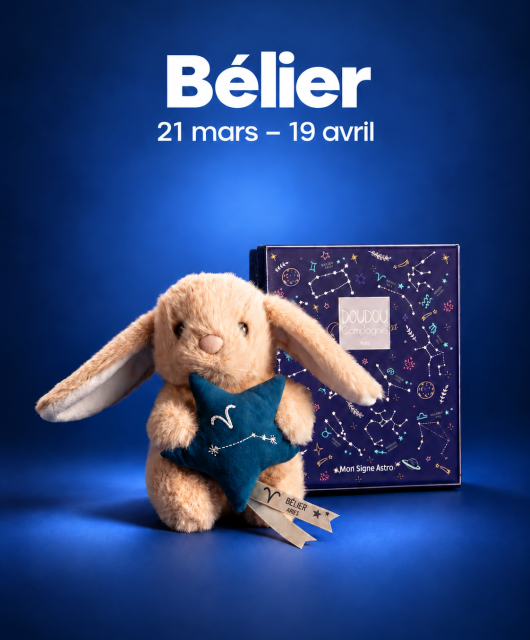 Peluche lapin Doudou Astro Bélier beige tenant une étoile bleue brodée de la constellation, avec étiquette du signe, sur fond blanc.