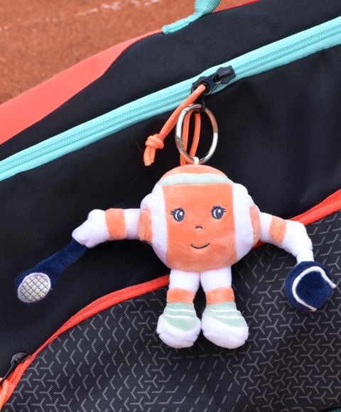 Porte clés balle  orange Roland Garros avec raquette et balle à la patte