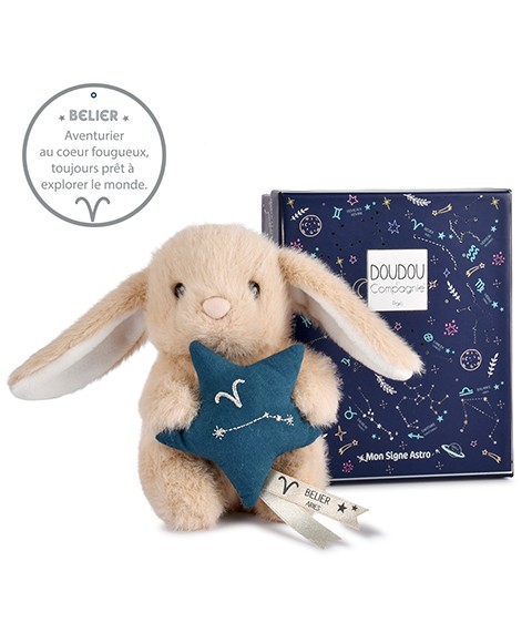 Peluche lapin Doudou Astro Bélier beige tenant une étoile bleue brodée de la constellation, avec étiquette du signe, sur fond blanc.